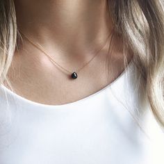 This black onyx sits on a dainty chain in 14k gold filled, rose gold, sterling silver or 14k solid gold. Subtle and simple, this beautiful semi-precious onyx necklace is the perfect everyday necklace and great for layering. This listing features our black onyx gemstone, but can be customized to your preference based on the gemstones available in our drop-down menu. The model is wearing the black onyx necklace in 16 inches and 14k gold filled. CRAFTMANSHIP  Jewelry is handmade by us in our NYC studio. We focus on craftsmanship and quality using only the highest quality materials and handpicked genuine gemstones.  PACKAGING We take pride in creating beautifully packaged orders. Jewelry arrives delicately wrapped in tissue and placed in a kraft box inside a logo drawstring pouch. Your package Minimalist Gemstone Necklaces For Everyday, Minimalist Gemstone Necklace For Everyday, Minimalist 14k Gold Charm Necklaces With Gemstone, Minimalist 14k Gold Gemstone Charm Necklace, Minimalist Rose Gold Jewelry With Gemstone, Minimalist Rose Gold Round Pendant Birthstone Necklace, Minimalist Rose Gold Gemstone Jewelry, Minimalist Rose Gold Birthstone Necklace, Elegant Black Charm Necklace With Clavicle Chain