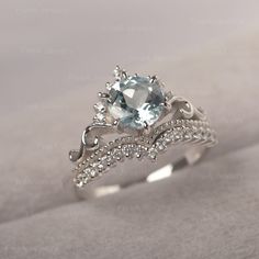 * The delicate ring displays aquamarine as main stone. The curved band beneath the gemstone makes the ring like an elegant crown. For who wearing this dainty ring, will shine like a queen. ◆ Production Description: Main stone Type: Aquamarine Main Stone Shape: Round Cut Main Stone Size: 7*7mm Side stone: CZ Metal: 925 Sterling silver - Other options available in the drop down menu ◆ Customization: √Free for Add Engraving √Other Metal Type Available √Other Gemstones & Shapes Available √Person Eternity Band Engagement Ring, Elegant Crown, Cute Promise Rings, Cute Engagement Rings, Future Engagement Rings, Zierlicher Ring, Dream Engagement Rings, Half Eternity Band, Aquamarine Ring