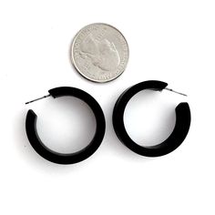 Black frosted lucite hoop earrings in a straight & sturdy shape. This style is known as the 'Chandler Hoop' (formerly known as the Small Portland Hoop) and comes in 2 sizes. The larger one is the Portland Hoop. This is the smaller of the 2, but is in no way a small hoop. It measures about 30mm or 1.25" in diameter & 10mm in width. One of our favorite styles & comes in many colors. Jewelry is designed & hand finished by us, here in the US. Most all are made with vintage lucite par Modern Plastic Hoop Earrings, Modern Small Hoop Earrings In Plastic, Modern Small Hoop Plastic Jewelry, Modern Plastic Hoop Jewelry, Modern Small Hoop Plastic Earrings, Modern Lucite Hoop Earrings, Surgical Steel Earrings, Vintage Lucite, No Way