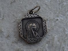 Religious antique French silvered catholic medal pendant medaillon medallion of Holy Mary of Lourdes. Measures are 0,63 x 0,76 inches ( 1,62 x 1,93 cm ) I bought this beautiful antique medal on a brocante ( fleamarket ) in France. I deliver all over the world. If you want more photos or information, you can contact me. If you don't have paypal, you can pay by bank transfer. Registered shipping is possible. Please take a look at my other items for sale.Registered shipping is possible and is costi Catholic Medals, Holy Mary, Bank Transfer, Virgin Mary, Items For Sale, Collectable Items, French Antiques, More Photos, Netherlands