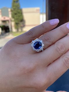 Genuine blue sapphire diamond statement ring. -Center stone is a gorgeous deep blue genuine sapphire. -Shape: Round/Oval. -Quality: Very high, Clean sapphire. -Carat weight: Approximately 3.39 carats. Setting/Diamonds: Halo vintage design with many brilliant round diamonds. - Average Diamond quality used: VS. - Diamond weight: 2 carats. -Metal: Solid 14k white gold. -Measurements: Sapphire halo face: 4.5mm. Graduated diamonds going down. Top to bottom: 1.2mm, mid 2mm, bottom diamond 2.2mm. Band Cushion Cut Sapphire Diamond Ring For Formal Occasions, Formal Sapphire Cushion Cut Diamond Ring, Sapphire Diamond Ring With Cushion Brilliant Cut, Sapphire Diamond Ring With Cushion Cut, Luxury Royal Blue Sapphire Ring With Diamond, Royal Blue Sapphire Ring With Brilliant Cut, Sapphire Cushion Cut Diamond Ring, Exquisite Sapphire Diamond Ring Gia Certified, Dazzling Sapphire Rings Gia Certified