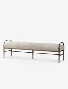 a metal bench with a cushion on it