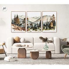 two paintings on the wall above a couch in a living room with chairs and tables