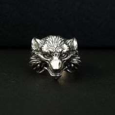 Vintage-Style Thai Silver Wolf Head Ring A masterpiece that captures the essence of rugged elegance. Crafted with meticulous attention to detail, this ring features a lifelike portrayal of a snarling wolf with an open mouth and exposed fangs. The antiqued finish adds a touch of authenticity, giving the piece a weathered and timeless allure. Materials: 925 Sterling Silver Ring Weight: 10.7 g Ring Width: 0.86"*0.72" Ring Size: Adjustable 9-12 US ☛ This silver men necklace suitable for any occasion and everyday wear ☛ This men jewelry is a very special gift for valentine's day gifts, birthday gifts, wedding gifts, Christmas gifts, party, anniversary gifts and more ☛ Comes with an exquisite gift box ----♛ PRODUCTION & SHIPPING ♛ --- ☛ Multiple items purchased in one payment can be combined for Wolf Beast, Snarling Wolf, Viking Wolf, Wolf Ring, Animal Ring, Silver Wolf, Head Ring, Wolf Head, Animal Rings