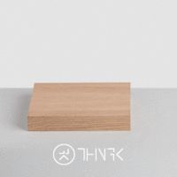 a close up of a wooden object on a white surface with the word think above it