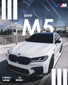 a white bmw m5 parked on the side of a road with an advertisement above it