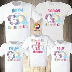 three personalized unicorn shirts with rainbows and stars on the front, one for each child