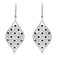 This is part of Chairish’s Fine Jewelry assortment.  Designer Blue Sapphire and Diamond Long Dangle Earrings to make a statement with your look. These earrings create a sparkling, luxurious look featuring oval cut gemstone. If you love to gravitate towards unique styles, this piece of jewelry is perfect for you.  PRODUCT DETAILS :-  > Material - 14K Solid White Gold > Gemstone - Blue sapphire  > Gemstone Weight - 1.88 ct > Gemstone Shape - Round  > Gemstone Pcs - 28   > Gemstone Size - 2.5 mm > Diamond Weight - 1.27 ct > Diamond size - 1 mm > Gross Weight - 13.79 Grams > Setting - Prong setting > Length - 55 mm  > Width - 21 mm White Gold Oval Earrings For Parties, Party White Gold Oval Earrings, Fine Jewelry Marquise Earrings For Evening, Oval Diamond Earrings For Party, Oval Gemstone Earrings For Evening, Elegant Sapphire Earrings With Diamond Cut, Elegant Oval Diamond Earrings With Gemstones, Elegant Marquise Earrings For Party, Elegant Pierced Sapphire Jewelry