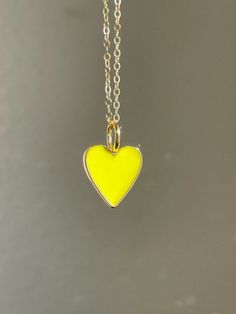 "Dainty Heart Necklace Pendant Anniversary Valentine's Day Your love Gift for Mom Gift for wife -Details Heart -  .75\" or 19.mm brass and yellow enamel, the back is gold and blank, not double sided Chain - 14kt gold filled link chain Length - 14 - 30\" -How to Order  Please select the chain Length from the  first drop down menu The standard length is normally 18\" For multiple necklace purchases please send us a quick email for pricing and availability -Questions  Remember photos can make pieces look larger or smaller in photos, please see the description for exact details All of our jewelry comes gift packaged.  To reduce unnecessary packing, each order comes with one gift box only.  Our pieces are handcrafted just for you in our Seattle, WA studio. Question? Please send us a quick email Heart-shaped Enamel Charms Necklaces, Heart-shaped Enamel Charms Necklace, Enamel Heart Charms Necklace, Yellow Heart-shaped Jewelry For Valentine's Day, Yellow Heart Beads Jewelry For Valentine's Day, Yellow Jewelry With Heart Beads For Valentine's Day, Valentine's Day Yellow Jewelry With Heart Beads, Yellow Necklace With Heart Charm For Gift, Yellow Heart Pendant Necklace For Valentine's Day