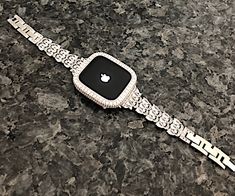 Fits the Apple Watch available for sizes 38,40,42,44,41,45,49mm Ultra in series 2,3,4,5,6,7,8,9,SE. Look at the back of your watch for Both the correct millimeter size and series. Available to purchase together or individually. (Does not fit the white top ceramic version) This beautiful Pear shaped crystal Apple Watch band Made with CRYSTALLIZED Swarovski Elements and or White gold Lab diamond Watch bezel case with lab diamonds that is custom plated 5 times in 14 karat white gold, rhodium a memb Luxury White Apple Watch Band With Bracelet Strap, Luxury Silver Apple Watch Band Gift, Luxury Silver Apple Watch Band, Luxury White Rectangular Watch Bands, Diamond Apple Watch, Rose Gold Apple Watch, Gold Apple Watch, Bracelet Apple Watch, Custom Plates