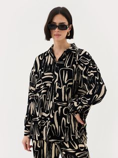 PRODUCT DETAILS Plisse fabric Relaxed fit All over abstract print Button features FABRIC AND FIT Model wears size UK 8 and is 5'9 100% Polyester STYLE NOTES Cosy and chic. The Tia two piece is the perfect day time, on the go look. Elevated comfort. We can't get enough. Oversized Long Sleeve Shirt With Abstract Print, Fall Workwear Shirt With Abstract Print, Fall Abstract Print Shirt For Workwear, Fall Abstract Print Shirt For Work, Fall Abstract Print Workwear Shirt, Chic Oversized Printed Blouse, Patterned Graphic Print Relaxed Fit Blouse, Graphic Print Relaxed Fit Patterned Blouse, Relaxed Fit Graphic Print Button-up Blouse