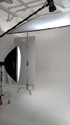 an empty photo studio with lighting equipment