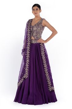 Purple lehenga with placement embroidered motifs. Comes with jacket-style cutwork border blouse and embroidered organza dupatta.
Component: 3
Embroidered
Neckline: V Neck
Sleeve Length: Sleeveless
Fabric: Raw silk, Organza, Silk
Color: Purple
Cutwork border
Cutout back
Scallop border dupatta - Aza Fashions Mrunalini Rao Lehenga, V Neck Lehenga, Mrunalini Rao, Purple Lehenga, Scallop Border, Embroidered Motifs, Embroidered Organza, Organza Dupatta, Silk Lehenga