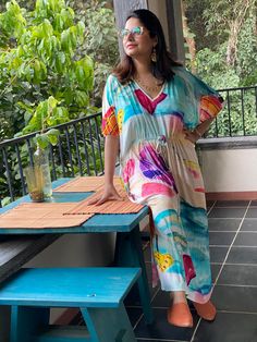 "This is our \"Timeless\" style kaftan. It features a drawstring that you can cinch at the waist. This loose fitting Caftan House dress is exceptionally comfortable and stylish. I created a short video about this style https://youtu.be/GDo-9c5XItk As for the fabric pattern, we have used a hand drawn and digitally painted technique. So they are all unique designs. It is like wearing wearable art. What I love about digital paintings is that they look as beautiful as the hand paintings but the care Casual Multicolor V-neck Tunic, Bohemian Flowy Maxi Dress With Drawstring, Flowy Bohemian Maxi Dress With Drawstring, Summer Maxi Dress With Drawstring For Vacation, Casual V-neck Kaftan For Daywear, Casual V-neck Relaxed Fit Kaftan, Green Beach Dress With Elastic Waistband, Casual Multicolor Flowy Kaftan, Spring Multicolor Maxi Dress For Loungewear