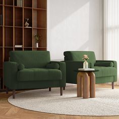 a living room with two green chairs and a coffee table in front of a bookcase