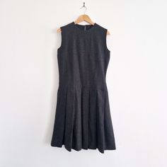 "Long and preppy vintage pinafore dress circa 1970s/80s, perfect for layering with a long-sleeve or jumper in the winter. * Charcoal, navy and chocolate brown fibres * Darted bodice * Pleated skirt * Bodice is lined * Handmade  * Metal talon zip SIZE * Bust: 37\"  * Waist: 34\"  * Hips: 35\"  * Length: 41\"   BRAND Unbranded, handmade. CONDITION Excellent condition.   Any questions? Ask away! :) FREE UK DELIVERY More vintage dresses at https://www.etsy.com/uk/shop/ragandmagpie?section_id=2449509 Vintage Pinafore Dress, Vintage Pinafore, Dress Preppy, Robes Vintage, Preppy Vintage, Vintage Preppy, Pinafore Dress, Dress Vintage, Dress Clothes For Women