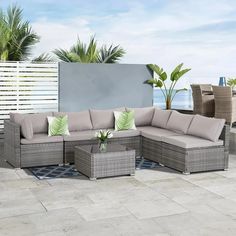 an outdoor patio furniture set with grey cushions