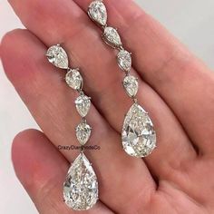 12.72 TCW Pear Cut Colorless Moissanite Diamond Earrings, Tear Drop Dangle Tennis Long Earrings, Screw Back 18k Yellow Gold Earrings, Gift ✹✹𝐖𝐞𝐥𝐜𝐨𝐦𝐞 𝐭𝐨 𝐂𝐫𝐚𝐳𝐲𝐃𝐢𝐚𝐦𝐨𝐧𝐝𝐬𝐂𝐨✹✹ Detail about stones Moissanite & Simulated Stone: ----------------------------- Stone Shape: Pear Cut Stone Size: 13X9 mm, 7X5 mm & 6X4 mm Weight: 12.72 TCW Color: Colorless Cut: Excellent Clarity: VVS ★ 𝑰𝒕𝒆𝒎 𝑫𝒆𝒕𝒂𝒊𝒍𝒔:- ☛ Metal Purity: Solid Gold (10KT, 14KT, 18KT); Silver(925 Sterling, 935 Argentium), 950 Platinum ☛ Metal Tone: Yellow, White, Rose ☛ Stamp/Hallmark: Yes ★ 𝑪𝒖𝒔𝒕𝒐𝒎𝒊𝒛𝒂𝒕𝒊𝒐𝒏:- ☛ Customized Design Jewelry. ☛ All cuts which you dream to make with moissanite. ☛ Updating every step of your ordered jewelry(Loose Stone, CAD & Making Process) ☛ All listed items in our stor Luxury Yellow Gold Sterling Silver Cluster Earrings, Sunlight Photography, Yellow Gold Earrings, Platinum Metal, Moissanite Diamonds, Pear Cut, Tear Drop, Long Earrings, Jewelry Earrings Dangle