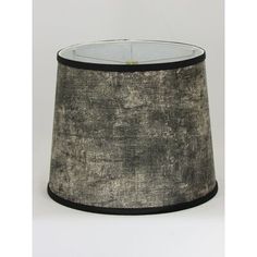 a black and white lamp shade on a table