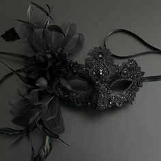 Masquerade mask in black. Simplistic for woman with a black floral- destined to pop out at any event, wedding etc This masquerade mask is great for any occasion. Luxury Black Masquerade Mask For Carnival, Luxury Black Masquerade Mask For Halloween, Luxury Black Masquerade Mask For Costume, Luxury Masquerade Mask For Parties, Luxury Artistic Masquerade Mask For Formal Events, Luxury Elegant Masquerade Mask For Costume, Luxury Black Masks And Prosthetics For Costume Party, Black Masquerade Dress Lightinthebox, Luxury Black Masks For Parties