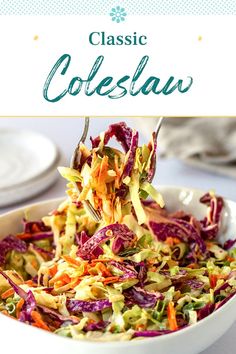 a white bowl filled with coleslaw on top of a table