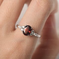 * The delicate ring displays Garnet as main stone. The cluster side stones make the ring similar to the blooming flower . For who wearing this special & delicate ring, will shine like a goddess. ◆ Production Description: Main stone Type: Garnet Main Stone Shape: Oval Cut Main Stone Size: 6*8mm(1.73ct) Side stone: CZ Metal: 925 Sterling silver - Other options available in the drop down menu ◆ Customization: √Free for Add Engraving √Other Metal Type Available √Other Gemstones & Shapes Avai Elegant Cluster Ring With Accent Stones For Proposal, Fine Jewelry Crystal Ring With Accent Stones For Proposal, Elegant Oval Ruby Ring For Proposal, Garnet Ring With Prong Setting, Elegant Garnet Crystal Ring With Gemstone, Elegant Oval Garnet Birthstone Ring, Elegant Round Garnet Crystal Ring, Elegant Garnet Crystal Round Ring, Exquisite Oval Ruby Promise Ring