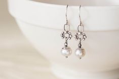 "Dainty sterling silver earrings with natural white freshwater pearl drops dangling on tiny and cute \"beaded\" silver ornaments. ● total length - approx 3.8cm ( 1.5 inches) ● weight - 1.5 grams each (super lightweight) ● pearls are approx 8mm Please keep in mind your brand new pair might vary ever so slightly from the pics, as each piece is individually handcrafted. Beads come from the same strand. ► Shop HOME: http://www.CookOnStrike.etsy.com/" Delicate White Pearl Earrings Nickel Free, Delicate Silver Pearl Earrings Nickel Free, Delicate Silver Jewelry With Dangling Beads, Delicate Sterling Silver Pearl Earrings For Everyday, Sterling Silver Drop Earrings With Dangling Pearls, Delicate Silver Pearl Drop Earrings, Dainty White Pearl Dangle Earrings, White Pearl Earrings With Dangling Beads As Gift, Dainty White Dangle Pearl Earrings