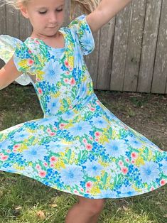 Green and Blue Floral twirl dress. Flutter sleeves, cross back, huge twirl, modest cut perfect for any occasion Spring Twirl Dress With Ruffles And Flowy Fit, Spring Flowy Twirl Dress With Ruffles, Flowy Spring Twirl Dress With Flutter Sleeves, Casual Summer Twirl Dress With Flutter Sleeves, Casual Flutter Sleeve Twirl Dress With Ruffles, Casual Twirl Dress With Flutter Sleeves And Ruffles, Spring Short Sleeve Flowy Twirl Dress, Spring Twirl Dress With Short Sleeves, Casual Spring Twirl Dress With Flutter Sleeves