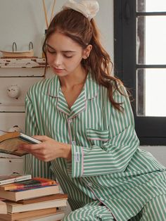 This unisex GREEN Stripe Pajama Set features a green background with pink vertical stripes, crafted from 100% polyester with medium elasticity for comfortable wear. The set includes a long-sleeve top with regular fit and bottoms with practical side pockets, available in sizes M, L, and XL to accommodate both men and women. The lightweight, non-clingy fabric requires gentle hand washing at 30° and offers minimal wrinkling, making it perfect for easy care while maintaining its vibrant print colors Long Sleeve Pajamas, Stripe Long Sleeve, Striped Pyjamas, Sleepwear Sets, Pajamas Set, Vertical Stripes, Long Sleeve Pyjamas, Green Background, Lingerie Sleepwear