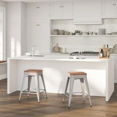 two stools are in front of the kitchen island