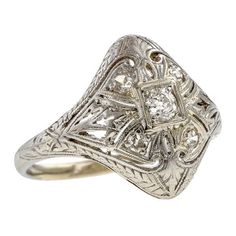 Art Deco Filigree Diamond Ring sold by Doyle & Doyle vintage and antique jewelry boutique. Filigree Diamond Ring, Art Deco Filigree, Button Bracelet, Cushion Ring, White Gold Diamond Rings, European Cut Diamonds, Diamond Necklace, Bangle Bracelets, Diamond Cuts