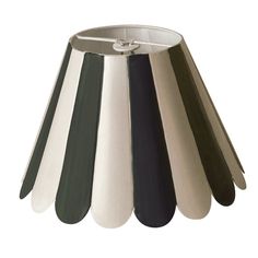 a silver and black lamp shade on a white background