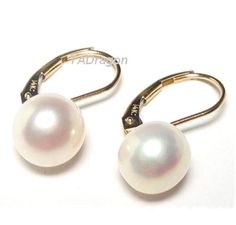 Gorgeous top quality genuine white pearl lever back earrings in 14K yellow gold or white gold     Pearls: high quality AAA grade genuine fresh water white pearls     Pearl shape: round with flat bottom     Pearl measurement: 9-10mm in diameter and 5-6mm in thickness     Luster: high     Metal: selectable: 14K yellow gold or 14K white gold  Actual pearls may vary slightly. White Gold Cross Pendant, Pearl Accessories, Tahitian Black Pearls, Dangle Necklaces, Gold Cross Pendant, Fine Earrings, Earring Findings, Gold Pearl, White Pearl