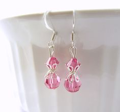 These beautiful pink earrings are created with rose pink Swarovski crystal element beads and beautiful silver bead caps. The earrings are composed of silver plated components. These pink drop crystal earrings are lightweight and great for anyone who loves pink. They come in a cute organza bag. See the matching necklace via the link below. LENGTH: about 1 & 1/2 inches total (top of ear wire to end of lowest bead) Matching pink bead necklace: https://www.etsy.com/listing/201854945/pink-necklac Pink Sterling Silver Crystal Earrings For Wedding, Pink Sterling Silver Drop Crystal Earrings, Pink Sterling Silver Crystal Earrings As Gift, Pink Dangle Crystal Earrings For Gift, Pink Crystal Ear Wire Earrings For Gift, Nickel-free Pink Crystal Earrings In Sterling Silver, Pink Sterling Silver Crystal Earrings Nickel Free, Pink Dangle Crystal Earrings With Faceted Beads, Pink Crystal Earrings For Pierced Ears