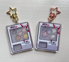 two key chains with buttons attached to them