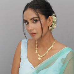 Description: Look classic with this simple and beautiful necklace from Tarinika. This Kundan necklace is a marvelous piece of beauty and will surely accentuate your look in a moment. Style it with any ethnic outfit of your choice and look your elegant best, effortlessly. Details & Specifications: Materials used: Brass Alloy with Matte Gold Platting Weight - Necklace 33 gm, Earrings 8 gm Length - Necklace 14 cm, Earrings 3 cm Make it custom Want to make it a custom Necklace? Sure! Reach out to us Chandbali Bridal Necklace With Elegant Design, Chandbali Temple Jewelry Bridal Necklace, Wedding Kundan Necklace With Elegant Design, Elegant Temple Necklace For Navratri Gift, Temple Necklace For Celebrations, Celebration Pearl Necklace For Diwali, Diwali Celebration Pearl Necklace, Elegant Kundan Jewelry Set For Navratri, Chandbali Temple Necklace As A Gift