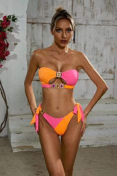 The Rita Orange Diamond Bikini exudes elegance and style. Its detachable padded cups provide customizable support while the crystal diamond detailing adds a touch of sparkle. With its unique bandeau and halter strap design, this two-piece swimsuit is perfect for those looking to make a statement at the beach or pool.  Materials: 100% Polyester Stretch Type: Slight Stretch Washing method: Hand wash  The model is 5 ft 7 and wears size S  Color may vary due to lighting on images. The product images Silver Sequin Top, Orange Diamond, Glitter Wedding Dress, Swimwear Trends, Perfect Figure, Halter Strap, Floral Shirt Dress, Crystal Diamond, Travel Party