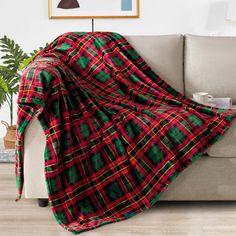 a couch with a plaid blanket on it