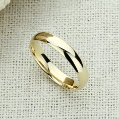 Elegant Harmony ✨💎 It gives you beautiful, attractive and outstanding jewelry experience ✨ Everlasting Confidence Wonderful Quality Stay Shiny Exquisite Fit 15,000+ customer reviews Free Shipping & Returns *Learn more 👍 Recommendations Perfect for everyday wear Ideal for travel or a destination wedding A perfect choice for an anniversary gift Description: This elegant wedding band is crafted from solid 14K gold and features a high-polished plain dome design that exudes timeless sophistication. Dome Wedding Band, Dome Wedding, Classic Wedding Band, Gold Piece, Best Diamond, Elegant Wedding, Rhodium Plated, Anniversary Gift, Wedding Band