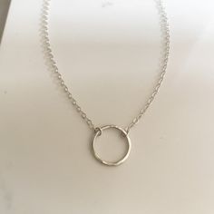 Your favorite new everyday necklace. The Full Circle necklace features a lightly hammered sterling silver or 14k gold fill circle suspended on an adjustable drop chain adored with delicate heart charm. Dainty Circle Charm Necklace With Delicate Chain, Dainty Circle Charm Necklace In Sterling Silver, Delicate Chain Open Circle Necklace, Delicate Chain Open Circle Necklace Gift, Minimalist Full Circle Necklace With Delicate Chain, Hammered Sterling Silver, Everyday Necklace, Circle Necklace, Herkimer Diamond