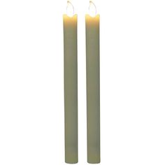 two white candles sitting next to each other