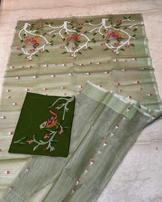 Absolutely beautiful in pastel shade ( pista green ),Tantuja muslin by muslin 120 count Jamdani saree.All over body  birds , flower and leaf motifs in Jamdani weaving. Selvedge bottle green border, fully woven palla.   Completely handcrafted item from the master weavers of Bengal. You can easily go for this light weight ,soft yet rich texture  , vibrant  coloured saree for a traditional attire for any occasion. This saree has no blouse piece. Attached blouse piece is an embroidered matching one .  Fall , pico complimentary. Pista Green Cotton Silk Saree With Resham Embroidery, Green Mulmul Unstitched Suit For Festivals, Green Unstitched Mulmul Suit For Festivals, Green Tissue Silk Unstitched Suit For Wedding, Green Slub Silk Dupatta With Zari Work, Green Zari Work Mulmul Dupatta, Green Slub Silk Salwar Kameez With Cutdana, Green Chanderi Unstitched Suit For Eid, Green Mulmul Dupatta