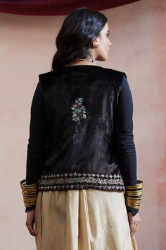 Black velvet jacket with zardosi and resham hand embroidery, including a large motif at the back.
Component: 1
Pattern: Hand embroidered
Type Of Work: Zardosi, Resham, Motif
Sleeve Type: Sleeveless
Fabric: Velvet, Lining : Cambric cotton
Color: Black
Other Details: 
Note : Only selling the product mentioned in the description.
Disclaimer : This product is handwoven and there might be slight irregularities in the weave.
Occasion: Sangeet - Aza Fashions Traditional Embellished Nehru Jacket With Long Sleeves, Traditional Long Sleeve Embellished Nehru Jacket, Embroidered Velvet Choli With Traditional Drape, Traditional Embroidered Velvet Choli, Traditional Velvet Long Sleeve Outerwear, Traditional Long Sleeve Velvet Outerwear, Festive Velvet Long Sleeve Outerwear, Traditional Embellished Festive Outerwear, Festive Outerwear With Handwork