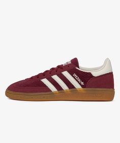 the adidas sneakers are maroon and white