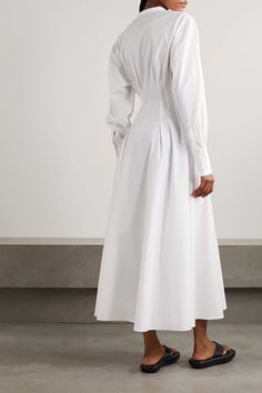 Find BEARE PARK Pleated Cotton-poplin Maxi Shirt Dress on Editorialist. This shirt dress is made from cotton-poplin with a mid-weight, non-stretchy fabric and is cut to create volume through the maxi skirt. The dress features a concealed button fastening through the front, buttoned cuffs, and is pleated throughout. The dress is ankle length and is perfect for pairing with boots, sandals, and sneakers. Classic Formal Shirt Dress With Cuffed Sleeves, Elegant Shirt Dress With Cuffed Sleeves And Spread Collar, Elegant Cuffed Sleeves Shirt Dress For Work, Elegant Shirt Dress With Pleated Sleeves For Daywear, Elegant Shirt Dress With Cuffed Sleeves For Work, Elegant Collared Shirt Dress With Pleated Sleeves, Formal Fitted Shirt Dress With Pleated Sleeves, Classic Formal Dresses With Cuffed Sleeves, Cotton Dress With Button Cuffs And Spread Collar