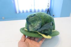 Click here to view all matching items https://www.etsy.com/shop/WOMENFELT?ref=seller-platform-mcnav&section_id=24902443 DETAILS: These felted hats are made with %100 natural merino wool. We use the traditional wet-felting technique. Felt has a soft feeling, so it keeps you warm without itching. And it's waterproof owing to its strong texture. This hat is unique, beautiful, and adorable. This hat is a versatile hat and can be worn with both dressy and casual attire. It is great for traveling Felted Hats, Soft Feeling, Cloche Hat, Green Wool, Wet Felting, Felt Hat, Casual Attire, Winter Hat, Matching Items