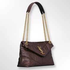 YSL Small Puffer Bag In Crinkled leather 577476AACQS6031
 	Color: Barolo Red.
 	Loulou in puffer version with Chevron quilt overstitching.
 	Calfskin leather.
 	Grosgrain-lining.
 	Bronze finished hardware.
 	Magnetic snap closure.
 	Sliding chain strap (Single Drops: 52 cm/Folded Drops: 28 cm).
 	Shoulder and Crossbody Carry.
 	1 zipped pocket.
 	Size: 29 x 17 x 11 cm.
 	Made in Italy.
 	Box, dust bag and documents included. Puffer Bag, Chevron Quilt, Pocket Size, Small Bag, Chain Strap, Ysl Bag, Snap Closure, Calf Skin, Zip Pockets