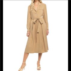 Lani The Label. Long Sleeve, Camel Colored Dress. Button Down. Optional Tie At The Waist. Can Wear Buttons Done Up Or Not. Fall Midi Dress With Button Closure, Fall Button-up Midi Dress For Office, Elegant Button-up Dresses With Pockets, Elegant Beige Button-up Midi Dress, Beige Long Sleeve Shirt Dress With Button Closure, Spring Collared Dresses With Buttoned Pockets, Fall Midi Shirt Dress With Button Closure, Beige Button-up Dress With Pockets, Beige Button-up Shirt Dress For Office