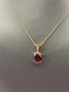 An elegant ladies oval shaped Garnet pendant hangs on a 14 karat solid yellow gold open link sparkle chain. Weight:  1.9 grams Length:  21 ½ " long Our Price $225.00 Regularly Priced At $450.00 Please See Our Video Remember - If you're purchasing for yourself or a gift for a loved one, buy with confidence.  We Guarantee Everything We Sell!  SKU # N741 Formal Jewelry With Oval Pendant And Cable Chain, Formal Oval Pendant Jewelry With Cable Chain, Formal Oval Pendant With Cable Chain Jewelry, Formal Oval Pendant With Cable Chain, Formal Oval Diamond Cut Necklaces, Formal Oval Diamond Cut Necklace, Yellow Gold Formal Necklace With Oval Pendant, Yellow Gold Oval Pendant Necklace For Formal Occasions, Classic Oval Pendant Necklace For Formal Occasions