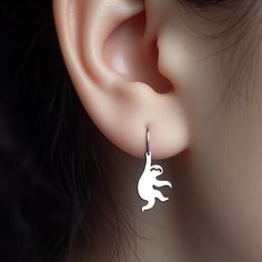 Height: 15mm Embrace the relaxed and charming vibe of these adorable Sloth Earrings! 🦥✨ Perfect for those who adore the laid-back lifestyle of sloths or anyone seeking a touch of whimsy in their accessories, these earrings are a delightful representation of one of nature's most endearing creatures. Available in sterling silver, solid 14k yellow gold, rose gold, or white gold, these minimalist sloth earrings offer a cute and stylish depiction of sloths. Whether you're an animal lover, a fan of unique jewelry, or simply appreciate the slower pace of life, these earrings are a wonderful addition to your collection. These Sloth Earrings are more than just a fashion statement; they're a nod to the gentle and peaceful spirit of sloths. Ideal as a thoughtful gift for a friend or as a charming pi Hypoallergenic Dangle Cartilage Earrings As Gift, Hypoallergenic Drop Cartilage Earrings Gift, Hypoallergenic Cartilage Drop Earrings For Gift, Cute Single Sterling Silver Earring, Sterling Silver Dangle Cartilage Earrings Gift, Simple Cartilage Earrings As Gift, Sloth Earrings, Sloth Jewelry, Lover Earrings